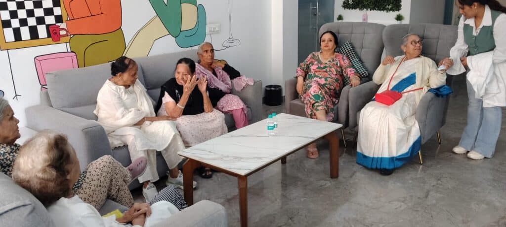 Seniors having relaxing chit chat at Gracias Living Lounge