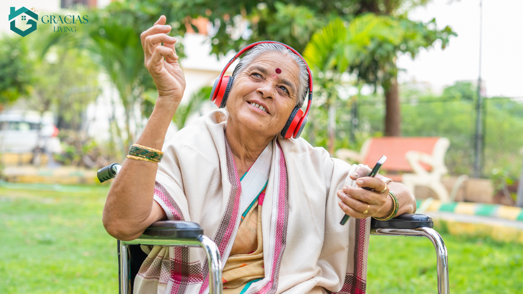 Elderly woman with dementia enjoying music therapy with headphones outdoors
