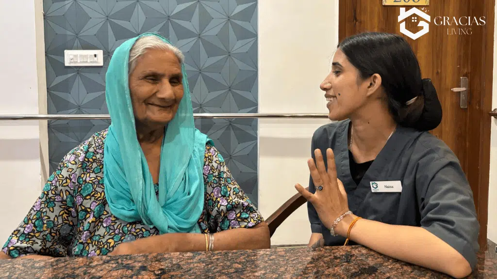 Caregiver sharing a light moment with elderly patient during in-home dementia care support