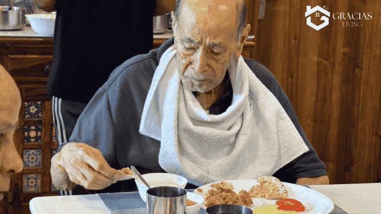 Caregiver helping elderly with meals during in-home dementia care support