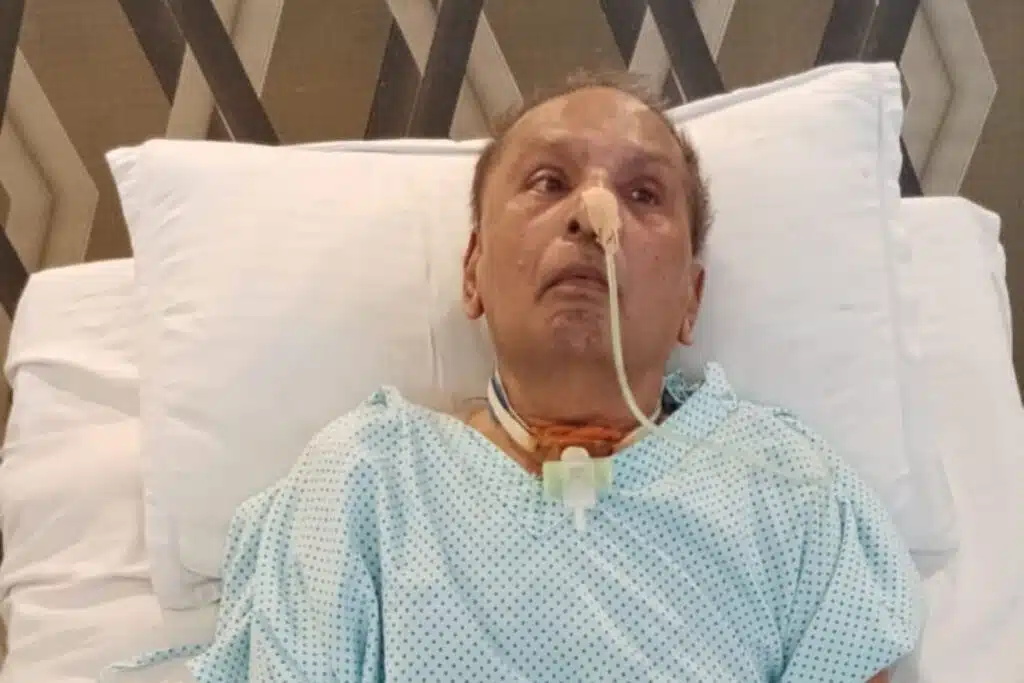 Stroke patient resting on a hospital bed while receiving medical care, with a nasal feeding tube and supportive monitoring during recovery and rehabilitation.