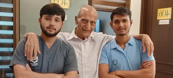 Senior resident standing with two caretakers at Gracias Living, Gurgaon